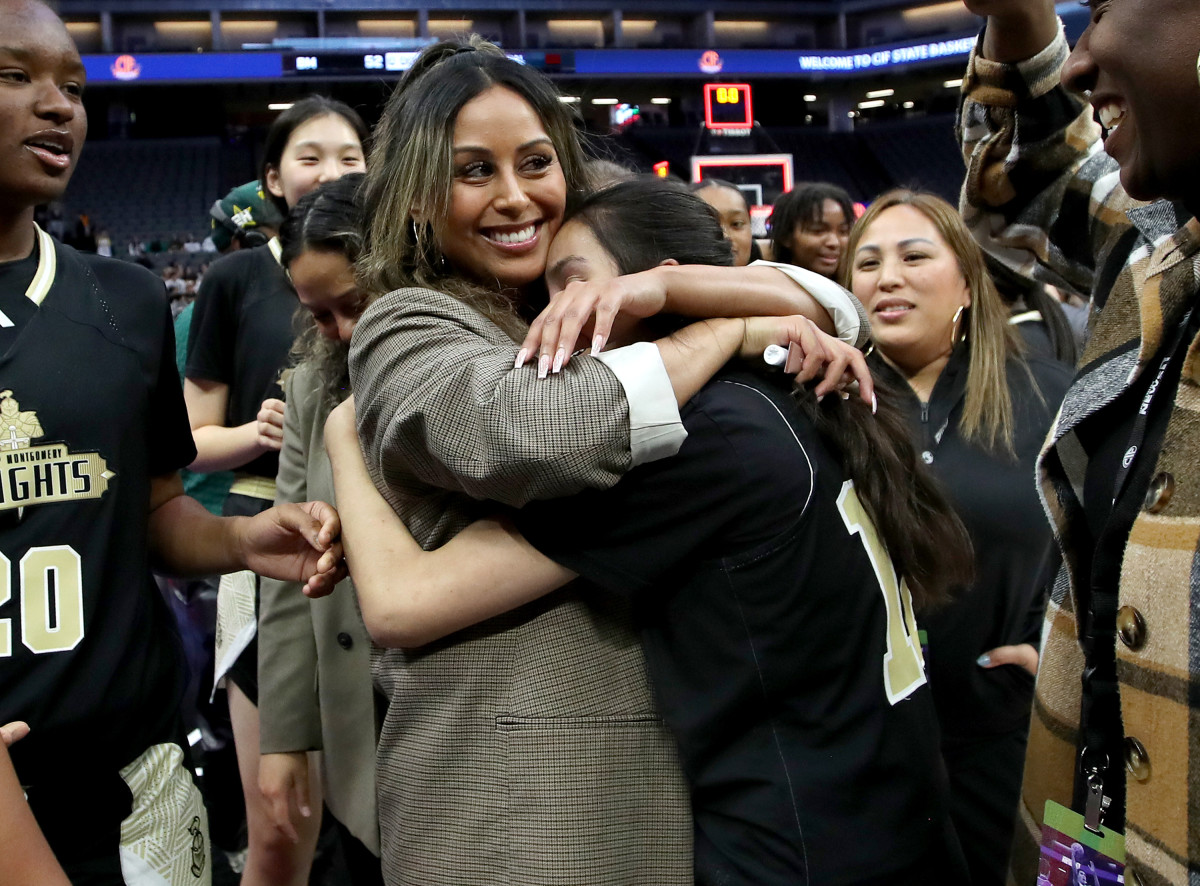 Hugs all around for Bishop Montgomery coach Rheina Ale and her Knights. 